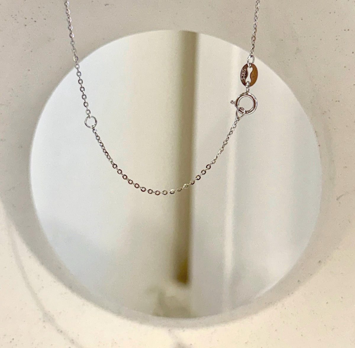 Tahitian pearl pendant with a crystal halo and silver chain.