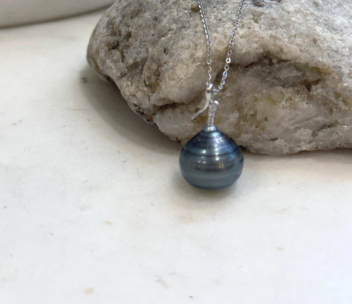 Lustrous Tahitian pearl pendant necklace in sterling silver.