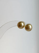Natural golden South Sea pearls with extreme luster.