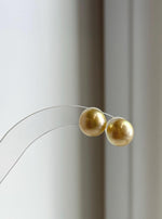 Genuine saltwater pearl studs with rich tea gold color.