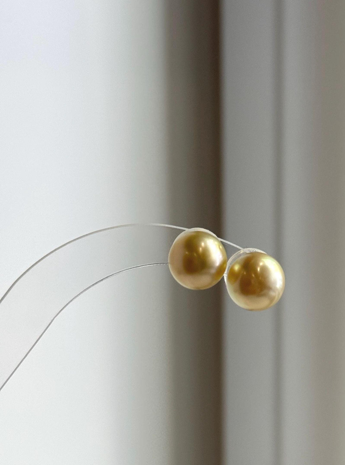 Genuine saltwater pearl studs with rich tea gold color.