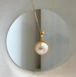 Ivory iridescent round ocean Mabe pearl pendant necklace with extreme mirror luster