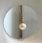 Extreme mirror luster ocean pearl pendant with elegant ivory overtones