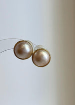 Ivory iridescent Ocean Mabe pearl stud earrings with extreme mirror luster