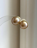 Ivory Ocean Mabe pearls with glowing rainbow iridescence