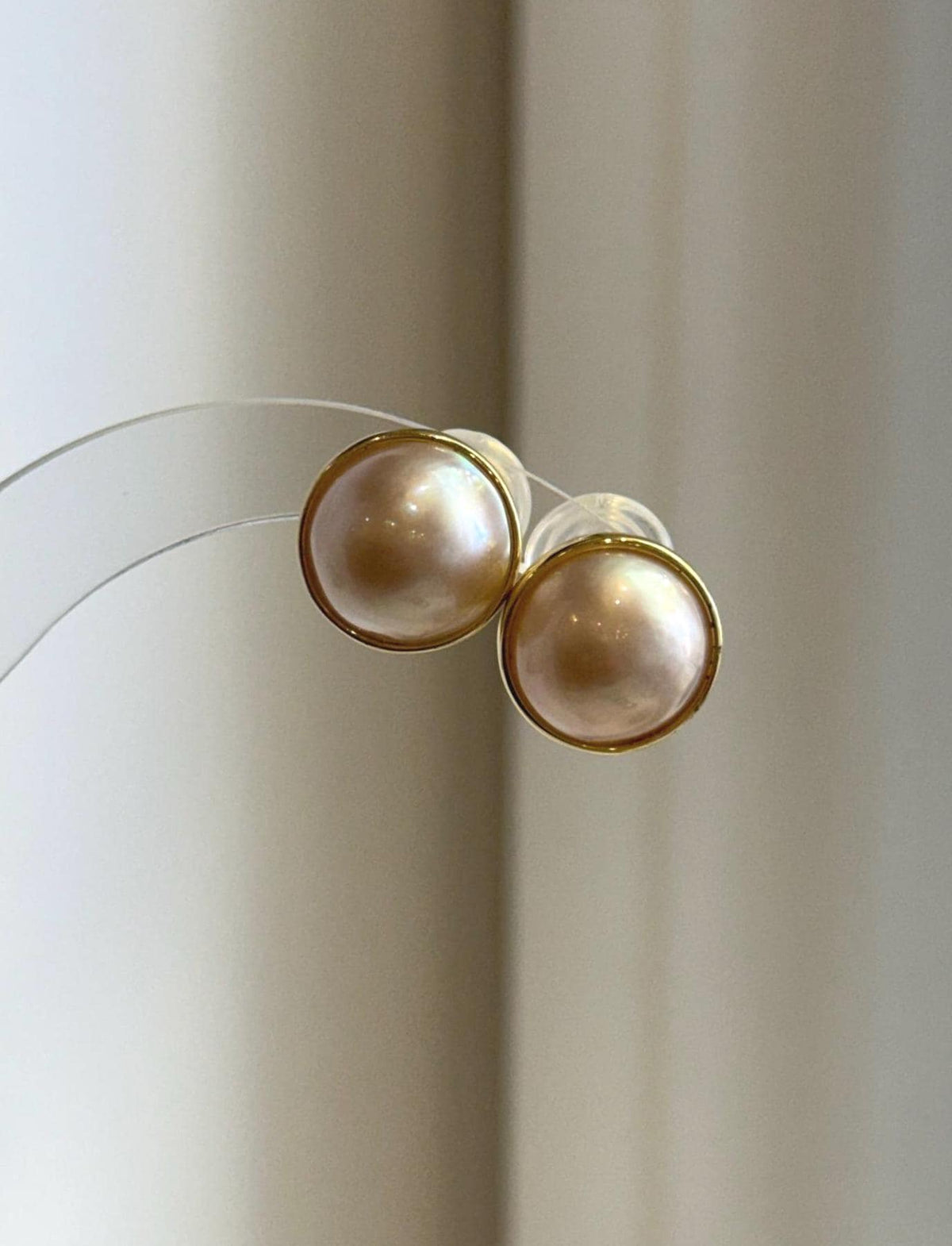 Ivory Ocean Mabe pearls with glowing rainbow iridescence