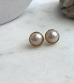 Classic round pearl earrings with extreme mirror-like luster