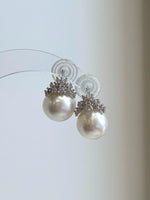 Luxury white pearl crown stud earrings with brilliant silver details