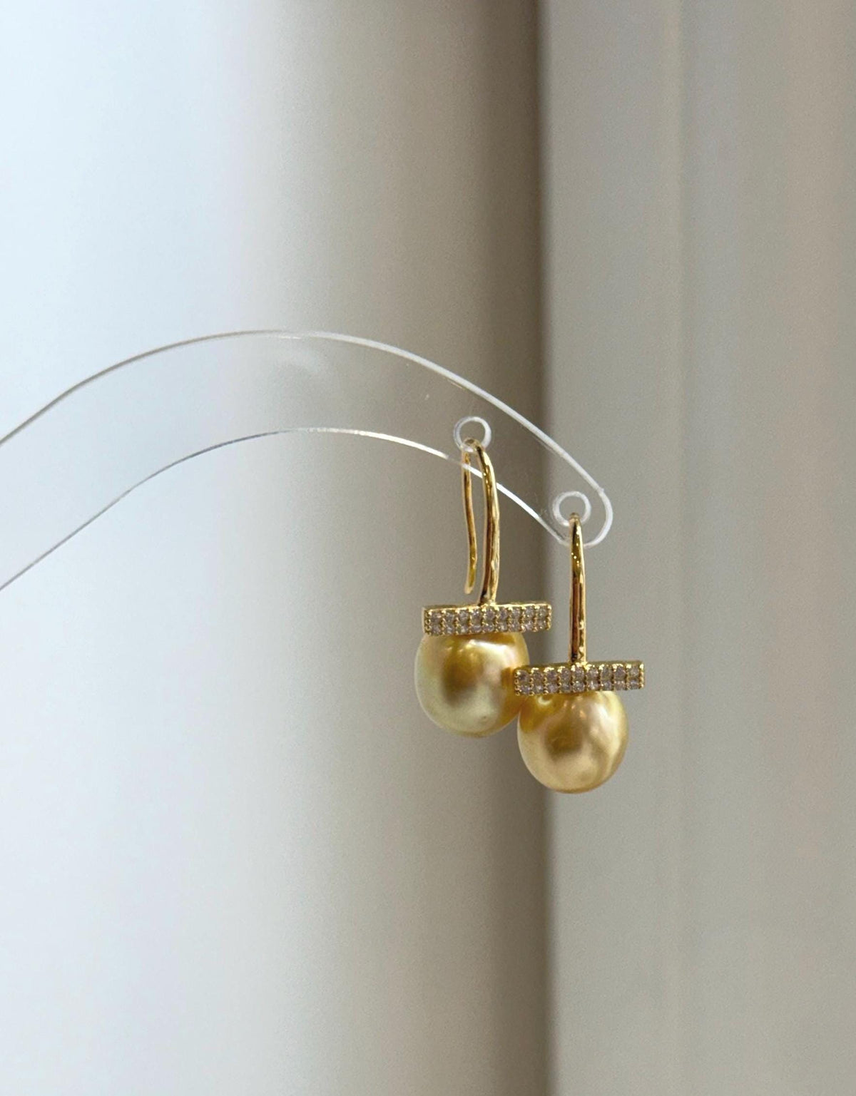 Deep tea golden pearls displaying rich color and brilliant reflections