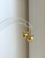 Deep tea golden pearls displaying rich color and brilliant reflections