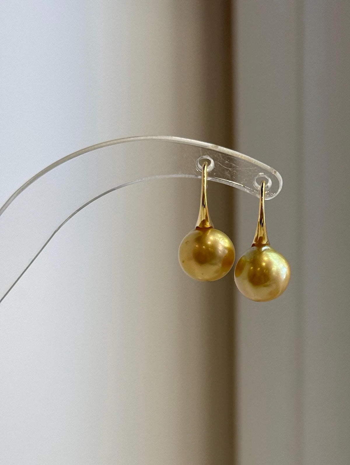 Golden South Sea pearl drops with silver high heel accents.