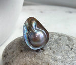 Genuine ocean mabe pearl in a sterling silver ring setting.