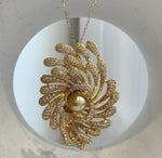Art Deco style pearl brooch featuring a lustrous South Sea golden pearl