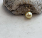 Lustrous golden pearl paired with solid 18K gold.