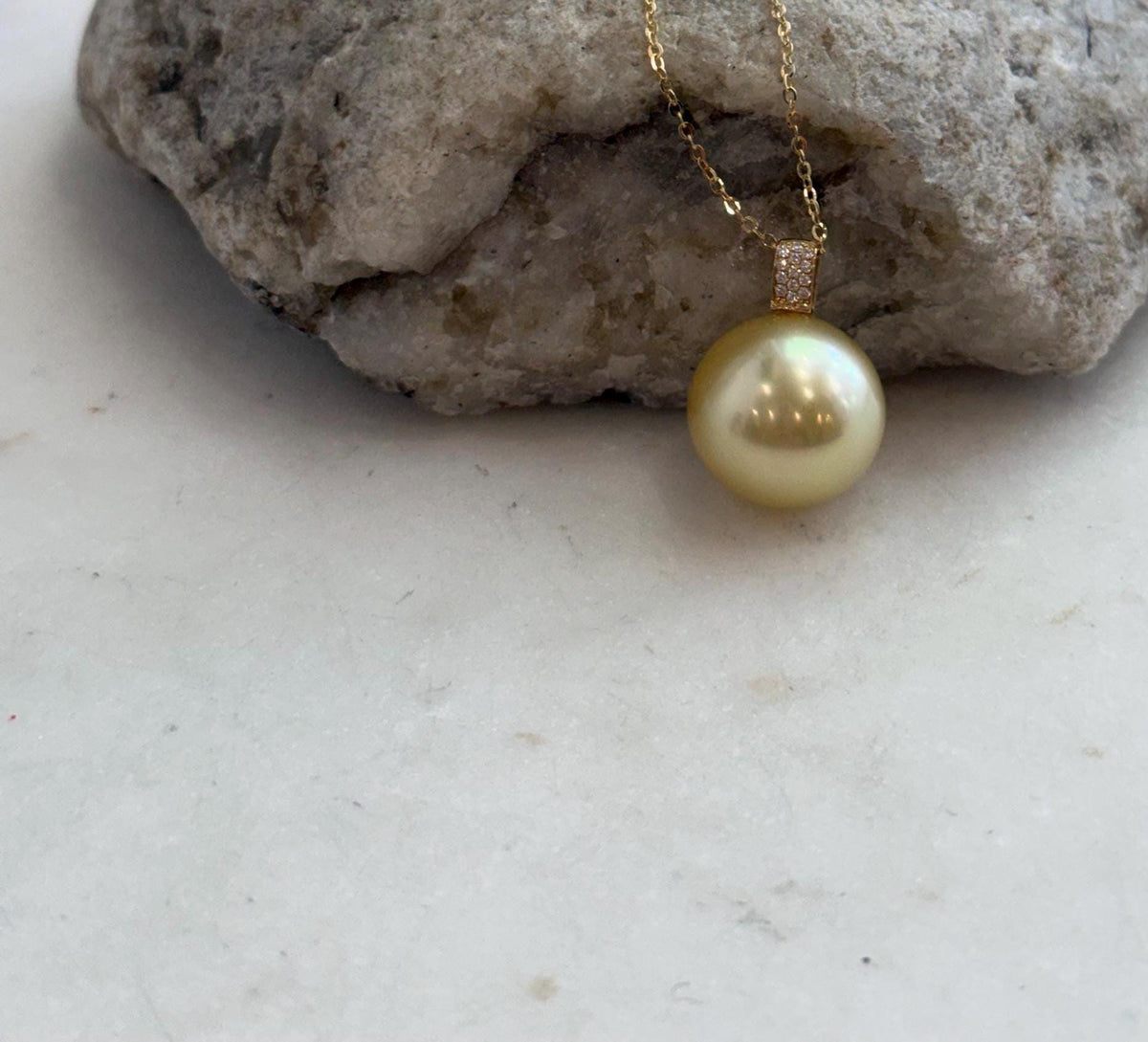 Lustrous golden pearl paired with solid 18K gold.