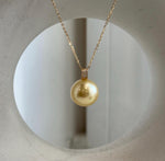 South Sea golden pearl with a reflective surface.