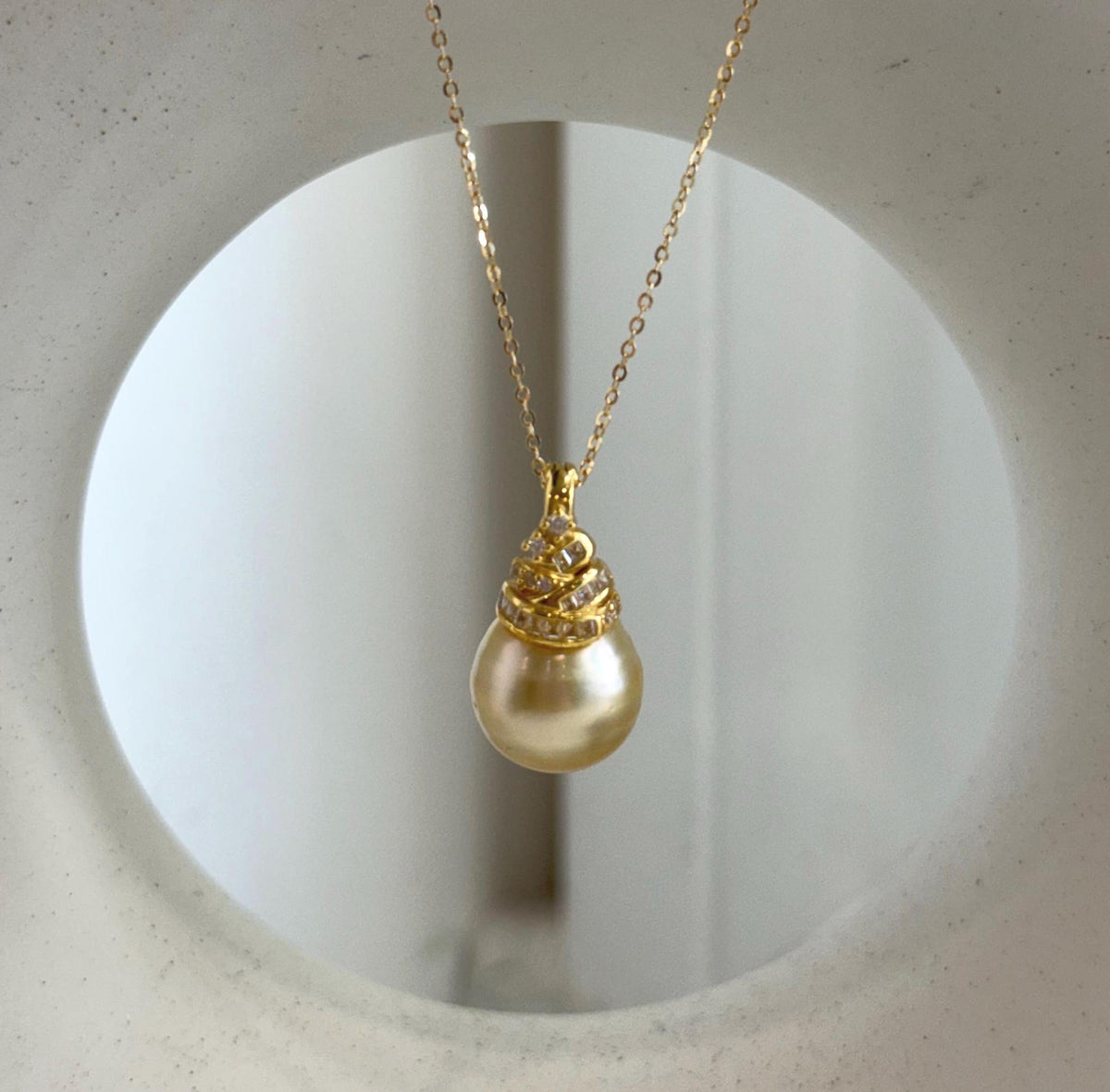 Rich tea gold saltwater pearl with a sterling silver setting.