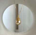 Rich tea gold saltwater pearl with a sterling silver setting.