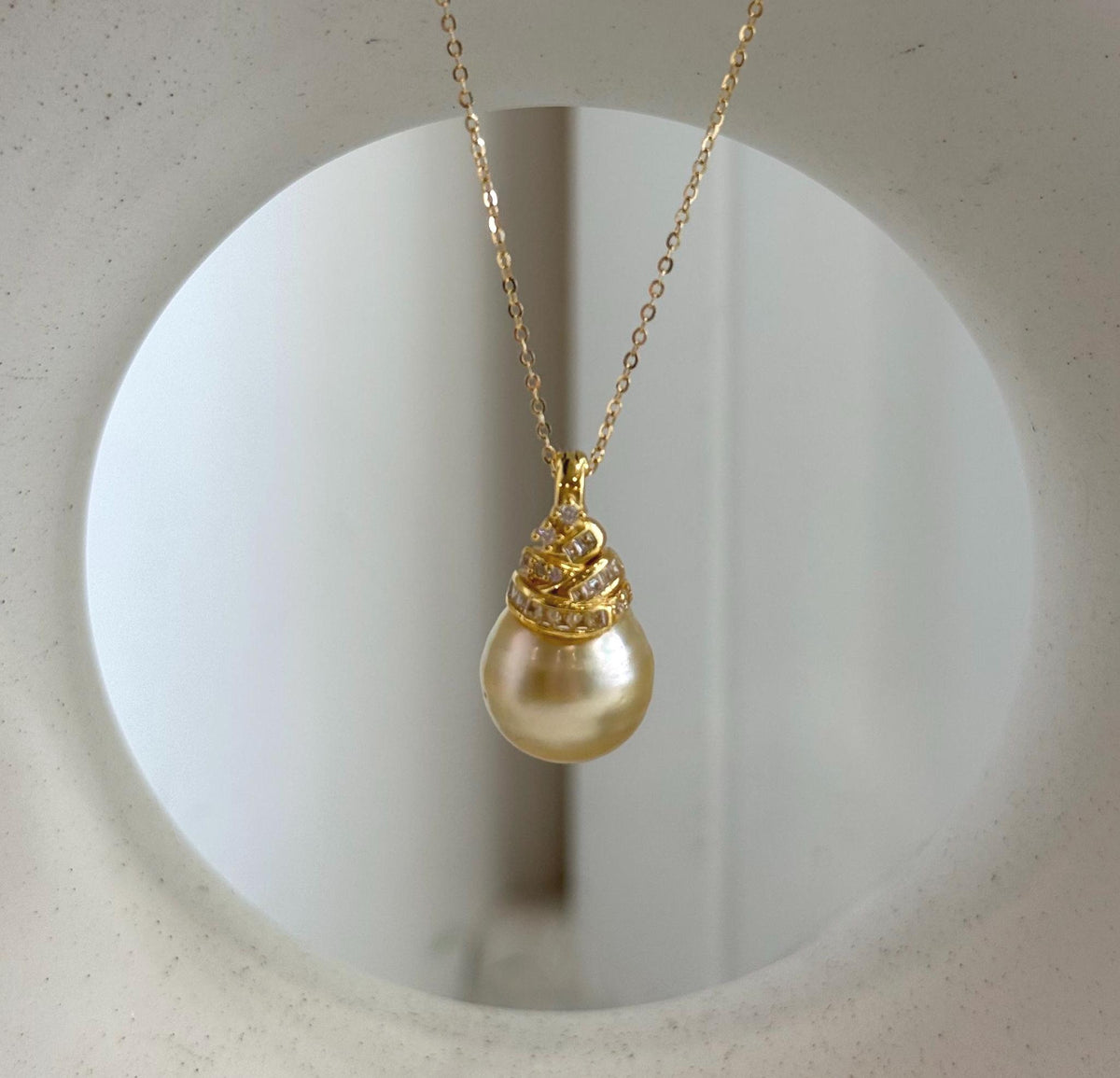Sterling silver pendant featuring a genuine South Sea pearl.