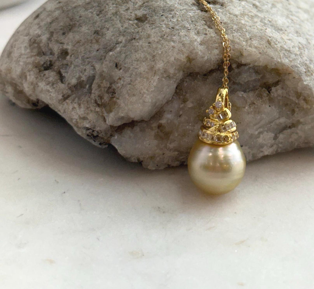 Deep tea gold pearl with a highly reflective surface.