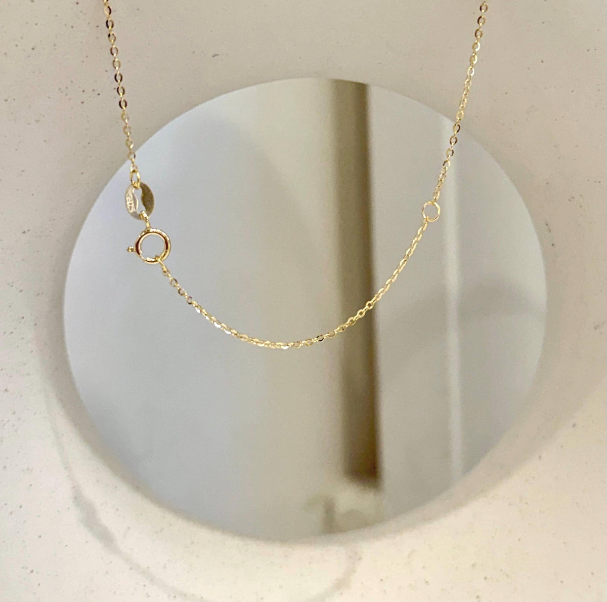 Golden saltwater pearl pendant with brilliant mirror luster.