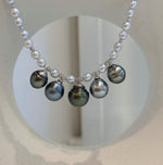 White pearl strand necklace with five dangling Tahitian pearls and S925 sterling silver components.