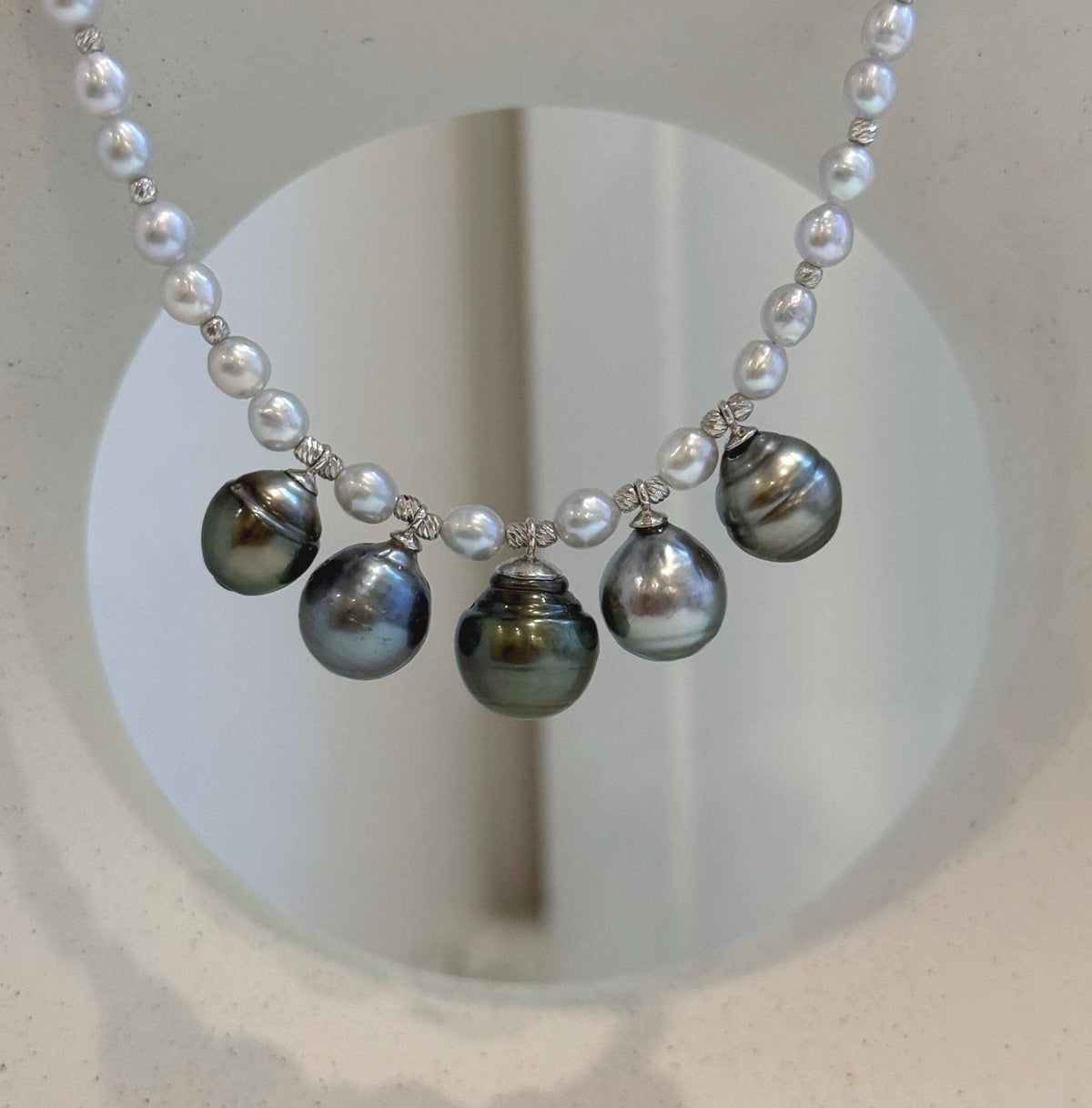 White pearl strand necklace with five dangling Tahitian pearls and S925 sterling silver components.