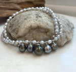 Front view of the necklace showing five Tahitian pearl drops across the center.