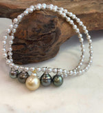 Five South Sea pearls showing their individual colors and natural surface details.
