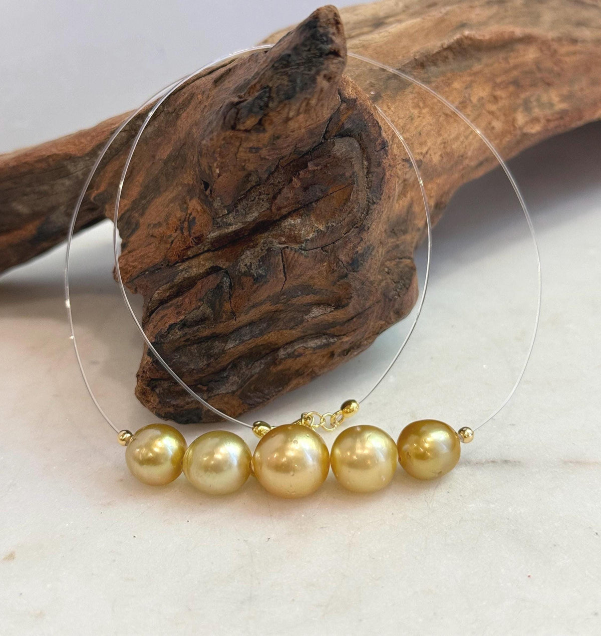 Close-up of the golden South Sea pearls and their high luster.