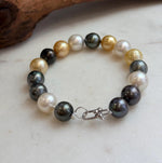 Ocean pearl bracelet with dark peacock green tones.