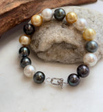 Ocean pearl bracelet with golden and silvery white accents.