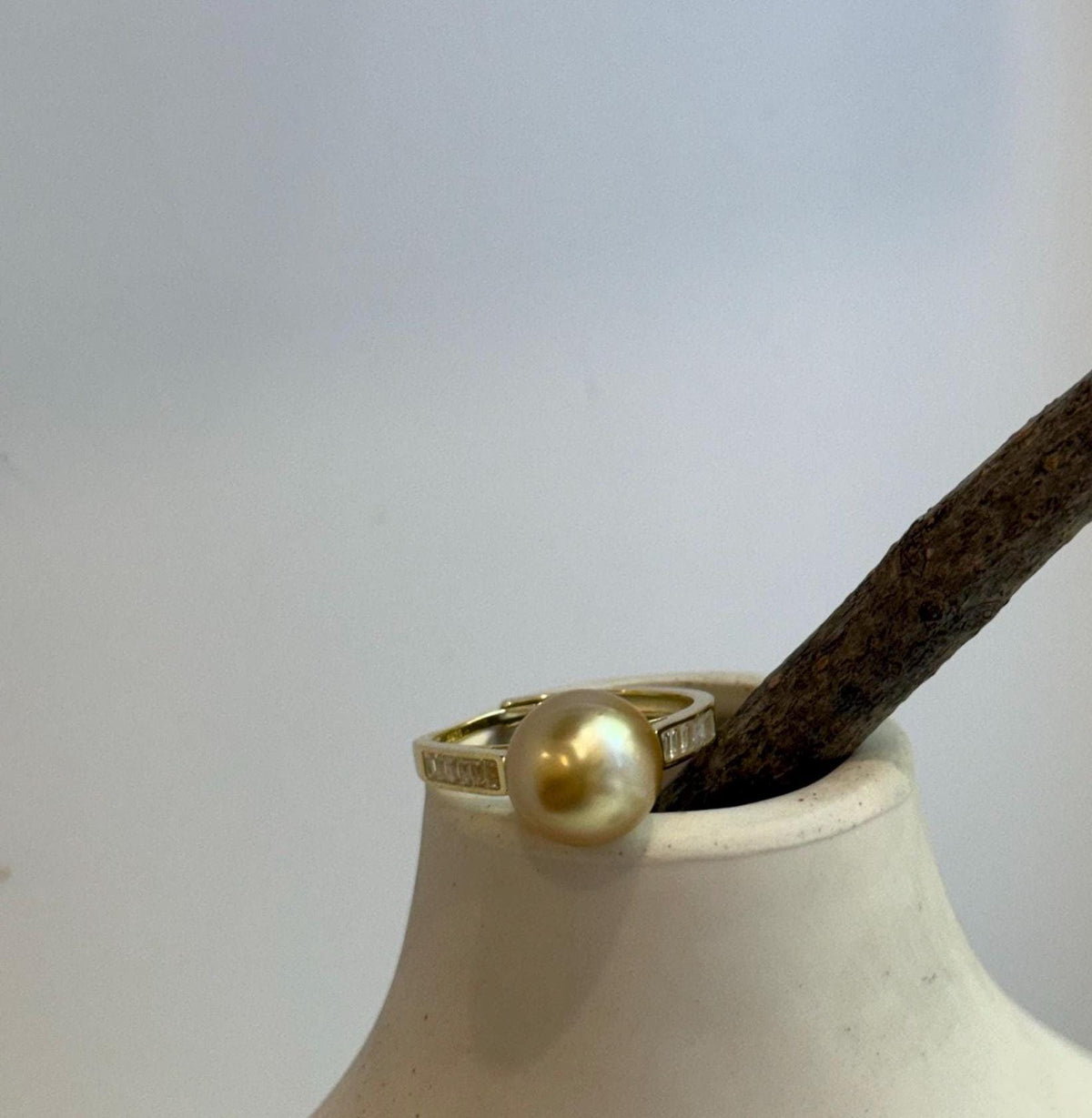 Deep tea golden South Sea pearl featured in an adjustable gold-plated sterling silver ring.