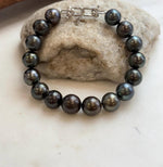 Sixteen Tahitian pearls strung into an elegant bracelet.