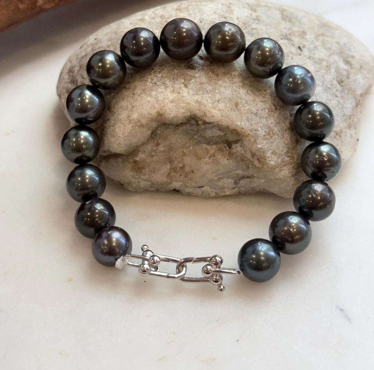 Tahitian pearl bracelet featuring green and silvery hues.