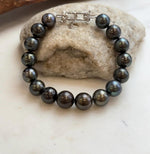 Platinum-toned Tahitian pearls on a classic pearl bracelet.