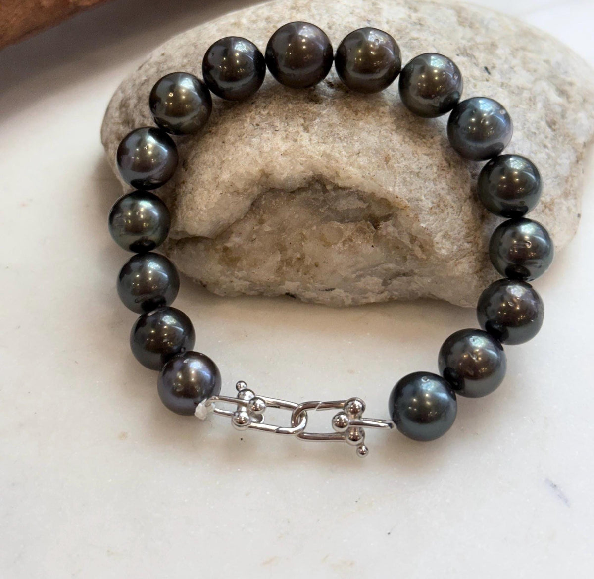 Tahitian pearl bracelet in rich hunter green and platinum hues.