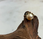 South Sea pearl with mirror luster set in a gold-plated sterling silver floral lace ring.