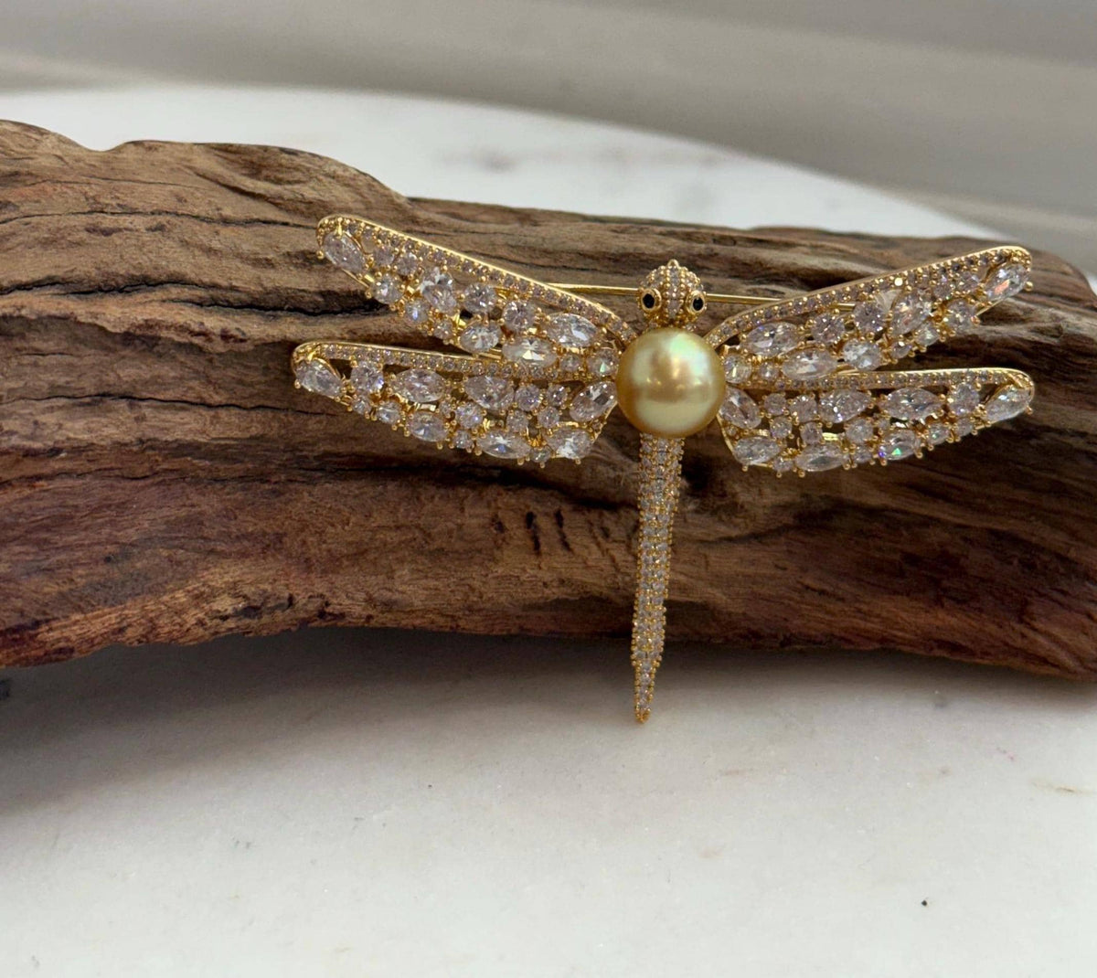 Dragonfly brooch pendant featuring a deep tea golden South Sea pearl with extreme mirror luster.