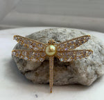 Genuine South Sea pearl with extreme mirror luster featured in a two-in-one dragonfly brooch pendant.