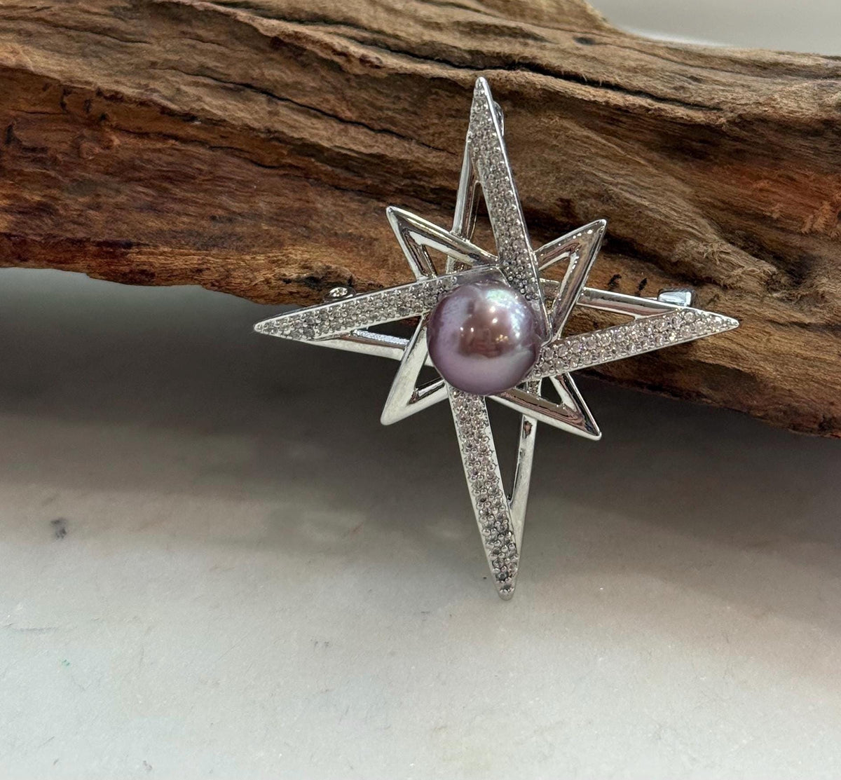 Detail of the star design surrounding the genuine freshwater pearl.