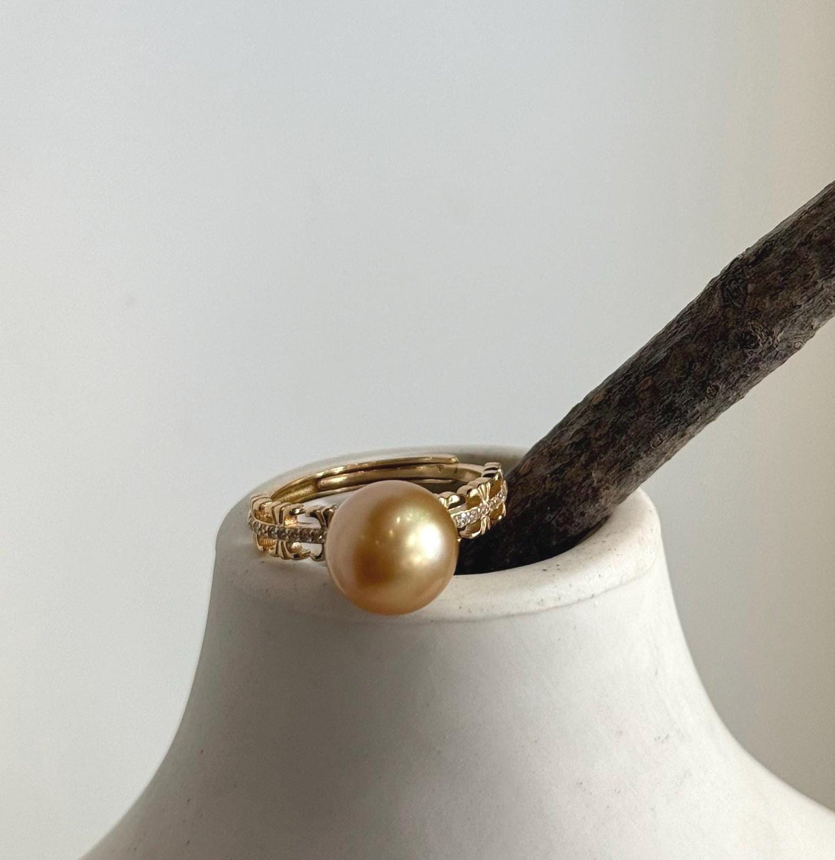 Close-up of the South Sea pearl showing its rich golden color and mirror luster.
