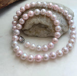 Classic pale pink freshwater pearl necklace with individual knots.