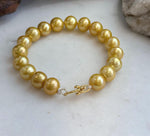 Freshwater pearl bracelet with warm golden tones