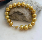 Edison pearl bracelet featuring 18 golden freshwater pearls