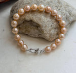 Peach and golden tones on genuine freshwater pearls