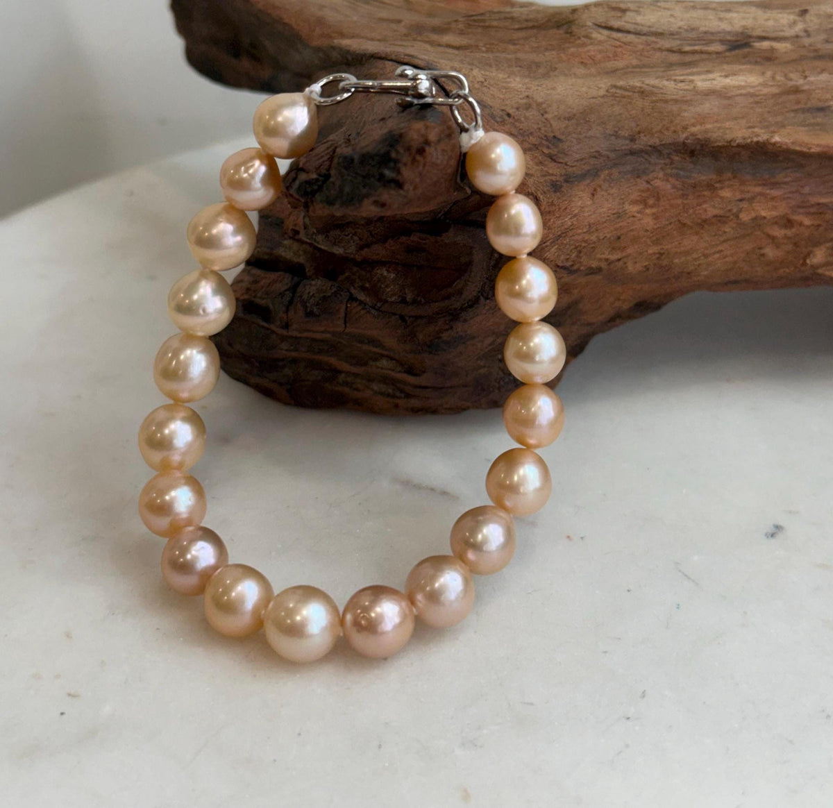 Mirror luster freshwater pearls with warm peach tones