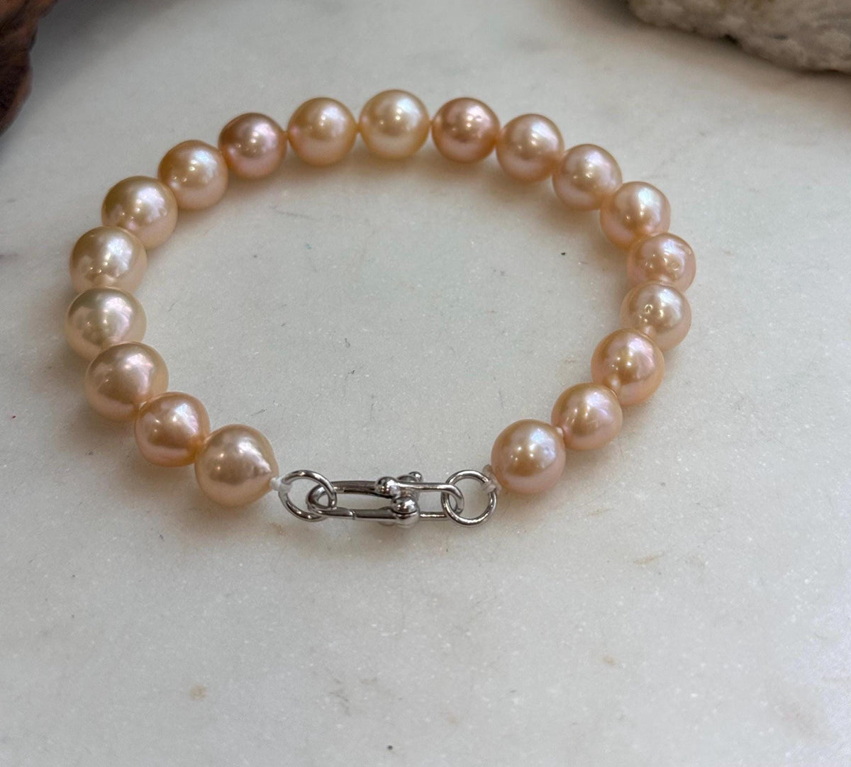 Peach golden pearl bracelet with sterling silver closure