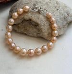 Genuine pearl bracelet featuring soft golden hues