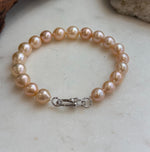 Warm peach golden pearls with reflective surfaces